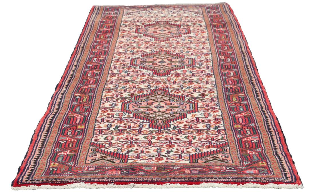 Hand-knotted runner from the Middle East in a deep red and beige palette