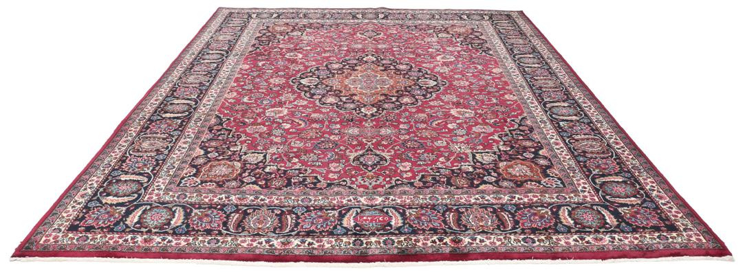 Hand-knotted Mashad rug from the Middle East featuring a dark-red field and floral patterns
