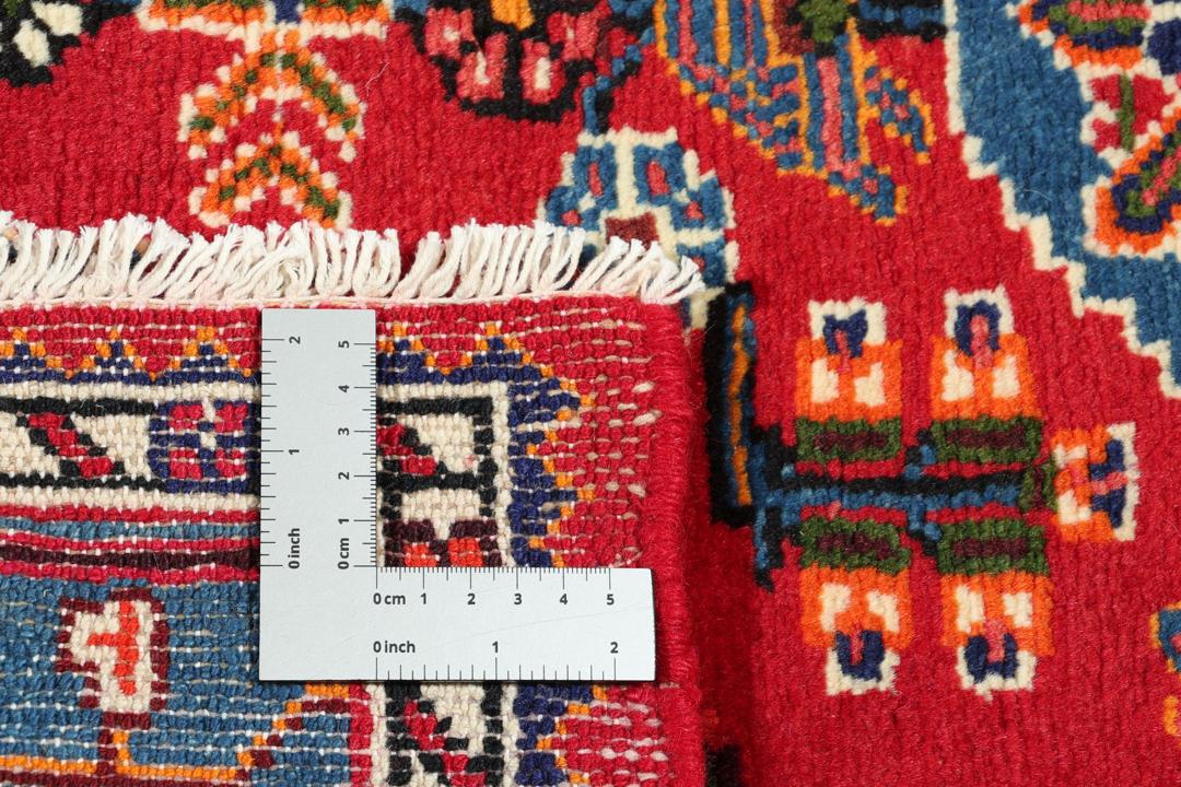 Hand-knotted Toiserkan rug from the Middle East in vibrant red and blue tones