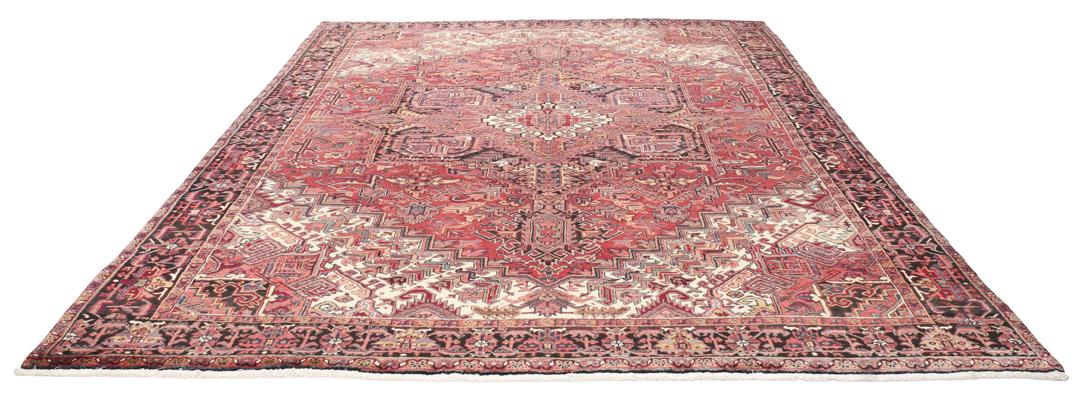 Handgeknoopt Heriz tapijt uit het Midden-Oosten met een gedurfd rood geometrisch patroon