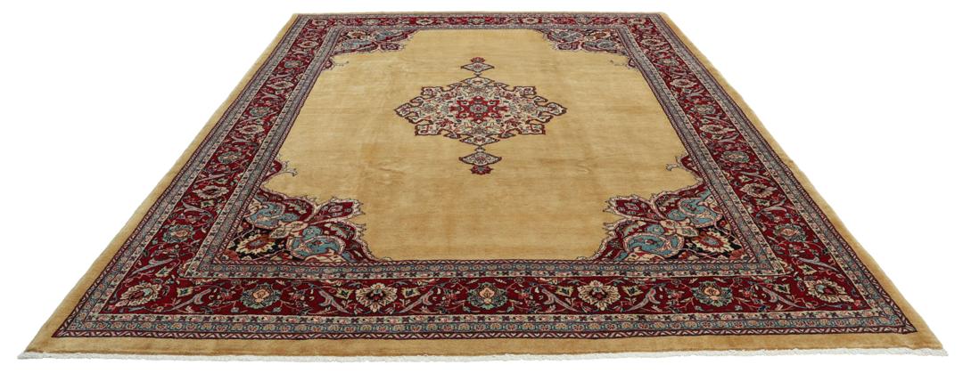 A hand-knotted Sarough rug from the Middle East with a beige field and red accents.