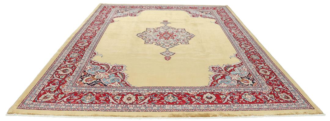 A hand-knotted Sarough rug from the Middle East with a beige field and red accents.