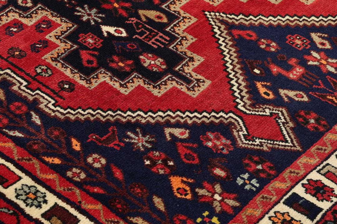 Hand-knotted Afshar rug from the Middle East in red and blue tones