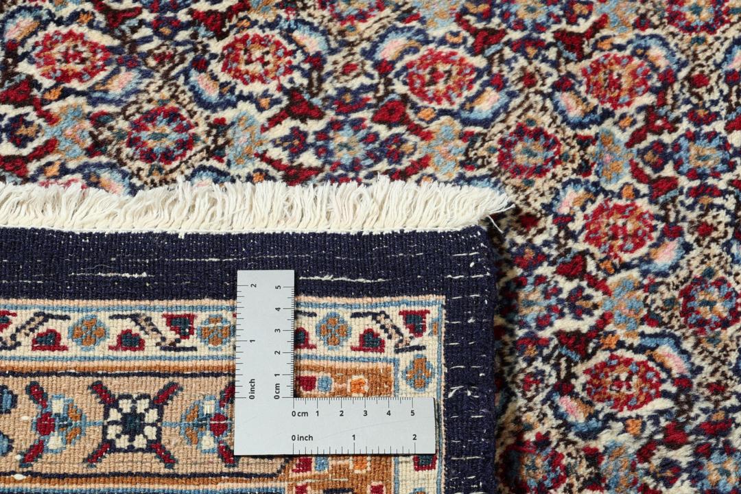 Hand-knotted Moud rug from the Middle East in shades of red and blue