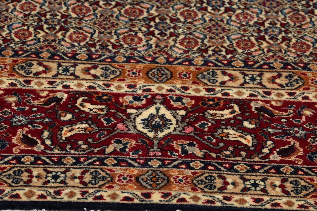 Hand-knotted Moud rug from the Middle East in shades of red and blue