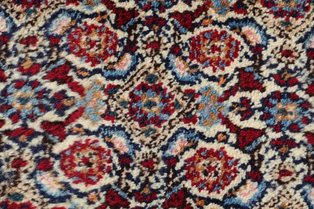 Hand-knotted Moud rug from the Middle East in shades of red and blue