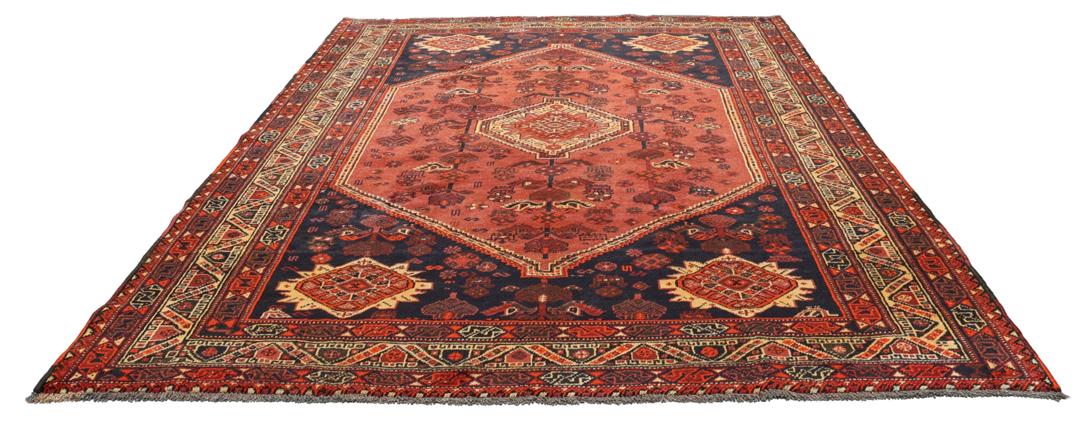 Handgeknoopt Shiraz tapijt met een dieprood en blauw geometrisch tribaal ontwerp