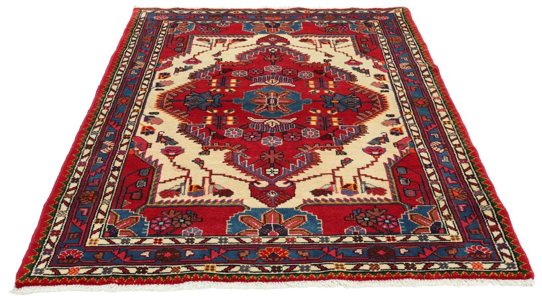 Hand-knotted Hamadan rug featuring a red field with blue and cream geometric motifs