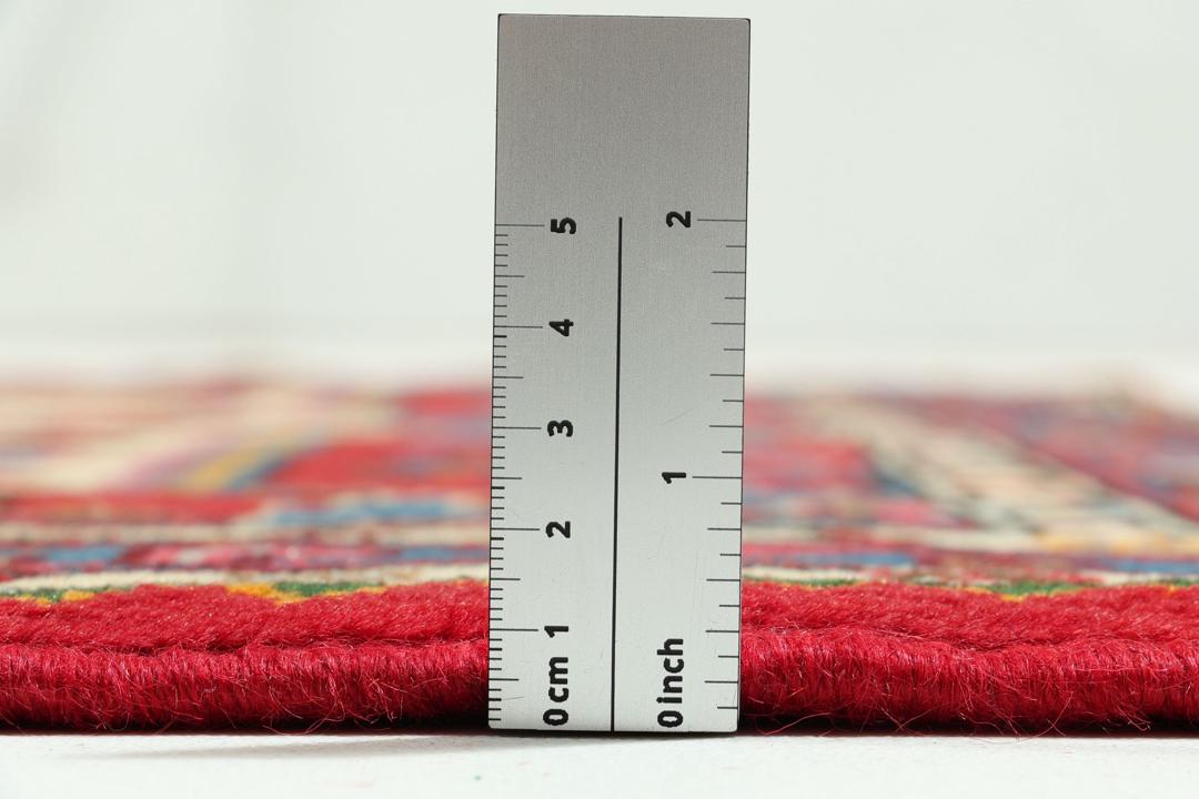 Hand-knotted Hamadan rug featuring a red field with blue and cream geometric motifs