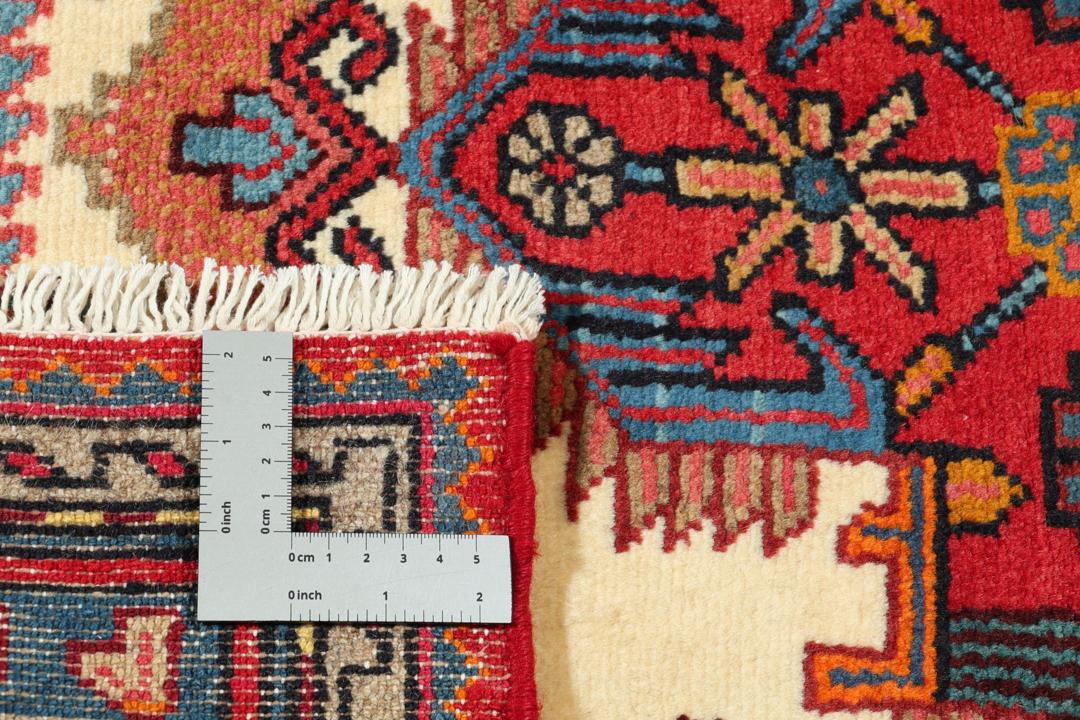 A hand-knotted Hamadan rug from the Middle East featuring a vibrant red and blue geometric design.