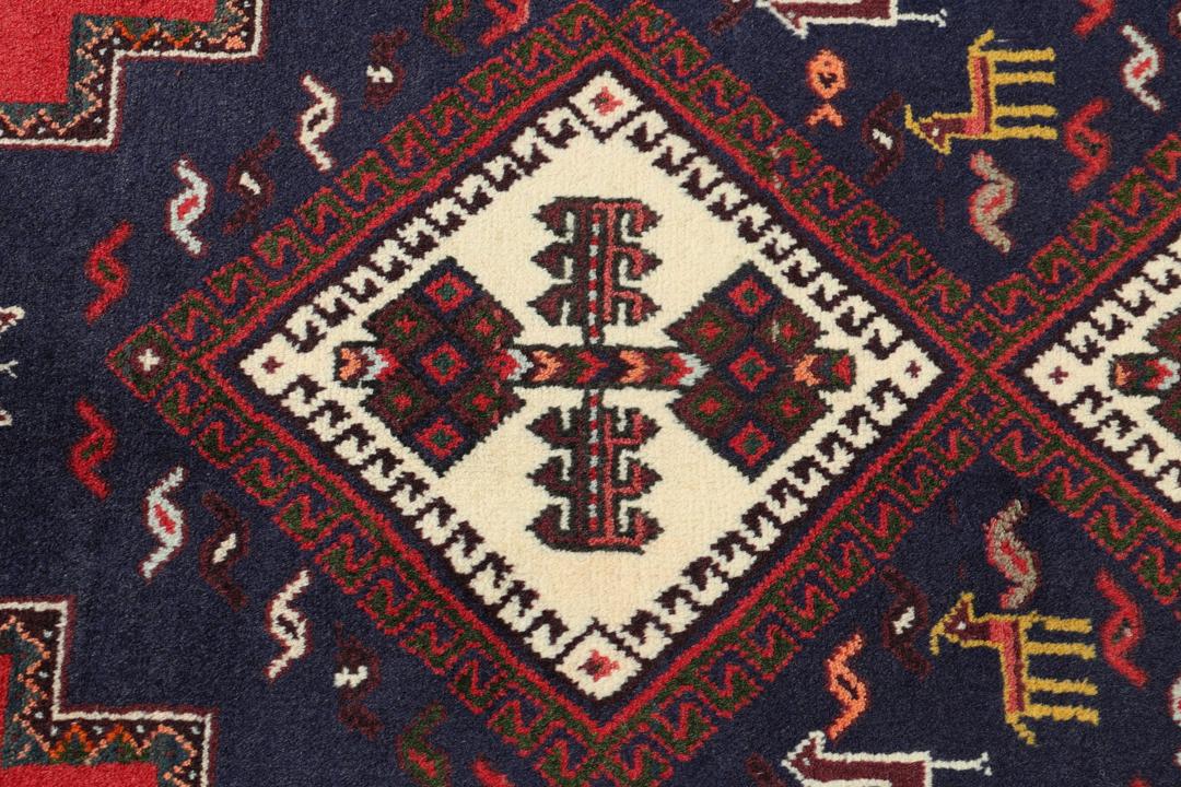 Hand-knotted Afshar rug from the Middle East featuring a red and blue tribal design.
