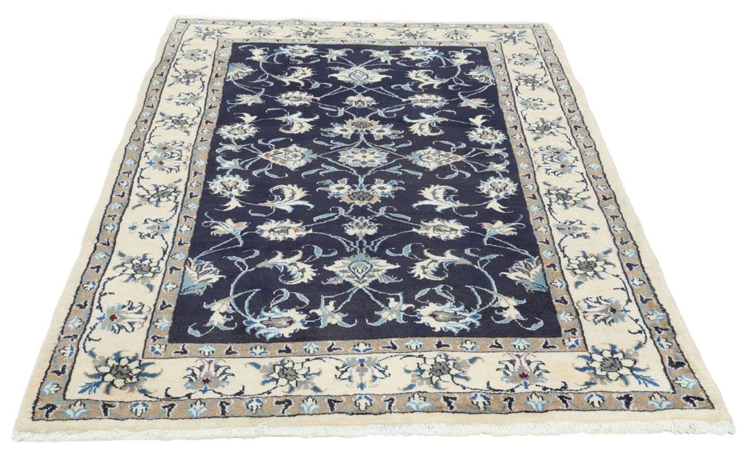 Hand-knotted Nain rug from the Middle East in dark blue and beige tones.