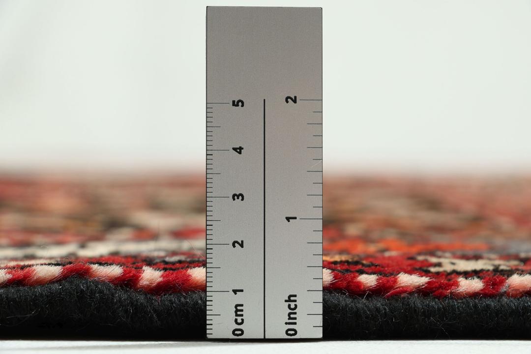 Hand-knotted Middle Eastern rug in multicolor featuring traditional geometric motifs