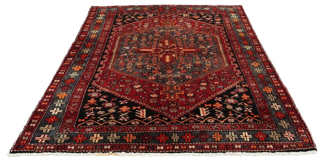 Hand-knotted Middle Eastern rug in multicolor featuring traditional geometric motifs