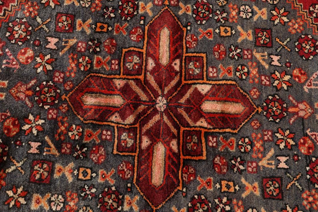Hand-knotted Middle Eastern rug in multicolor featuring traditional geometric motifs