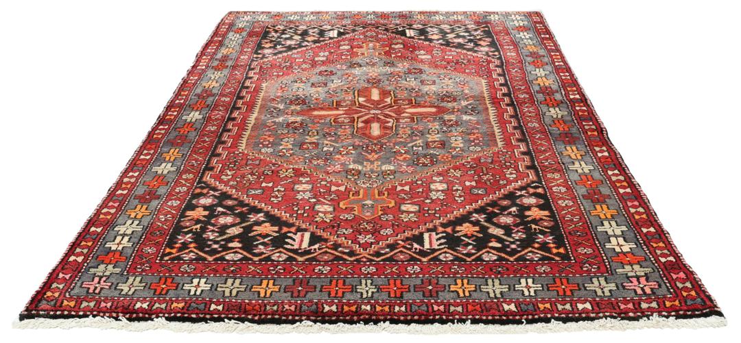 Hand-knotted Middle Eastern rug in multicolor featuring traditional geometric motifs