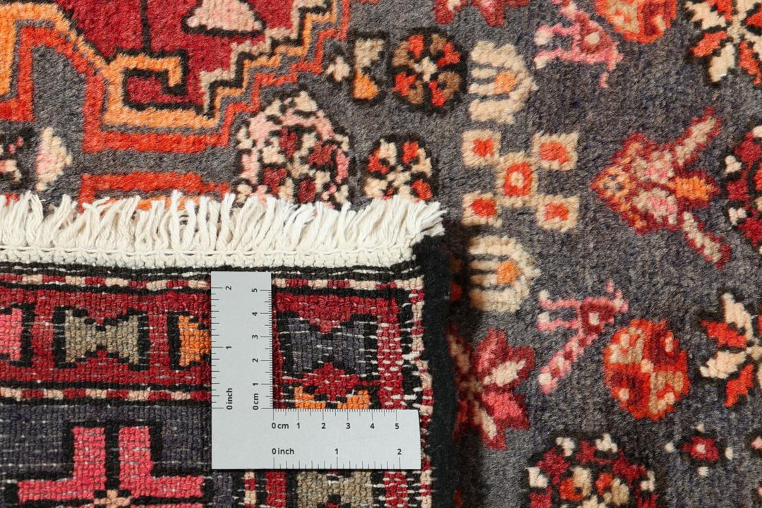 Hand-knotted Middle Eastern rug in multicolor featuring traditional geometric motifs