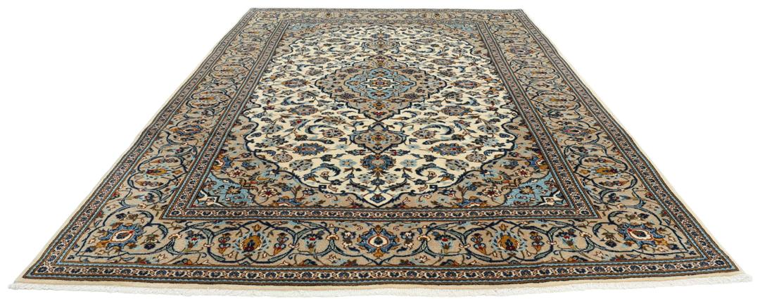 A hand-knotted Keshan rug from the Middle East featuring a blue and beige floral medallion pattern.