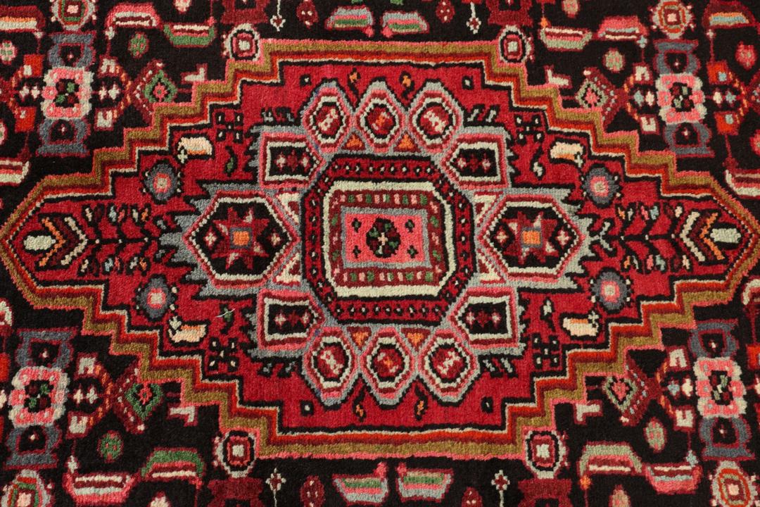 Hand-knotted Hamadan rug from the Middle East in dark-red and dark-blue tones.