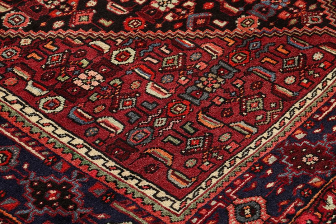 Hand-knotted Hamadan rug from the Middle East in dark-red and dark-blue tones.