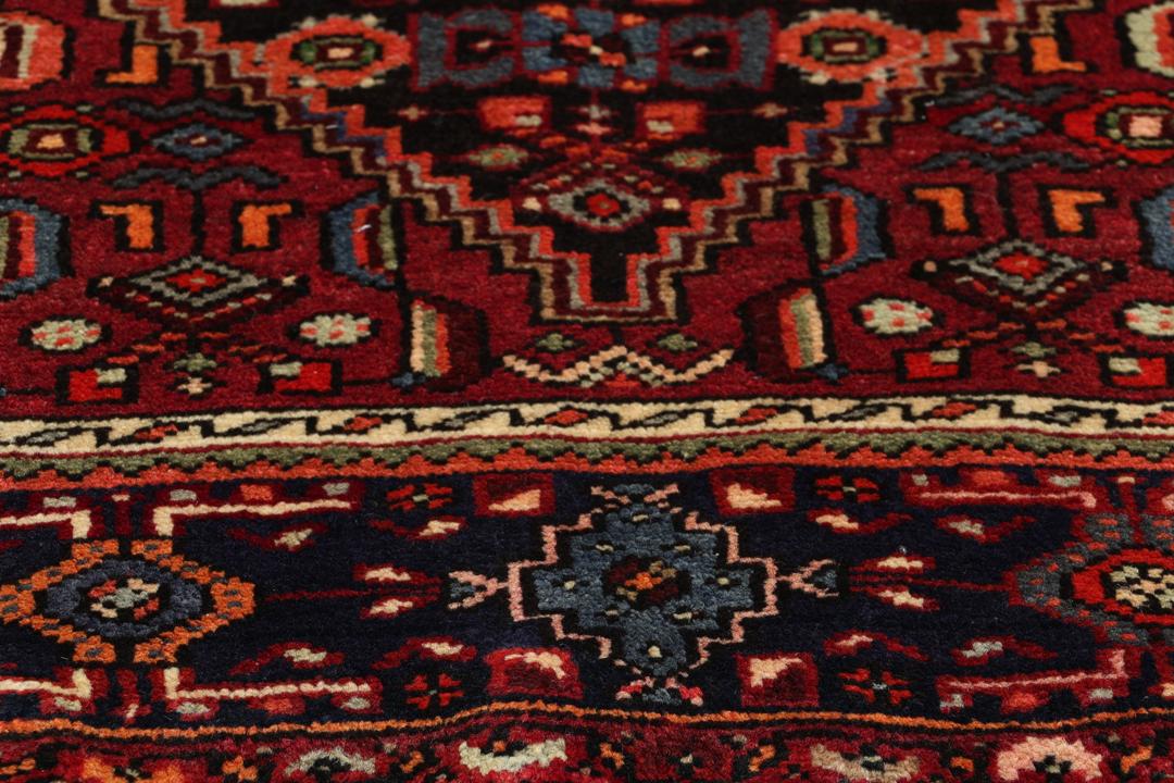 Hand-knotted Hamadan rug from the Middle East in dark-red and dark-blue tones.