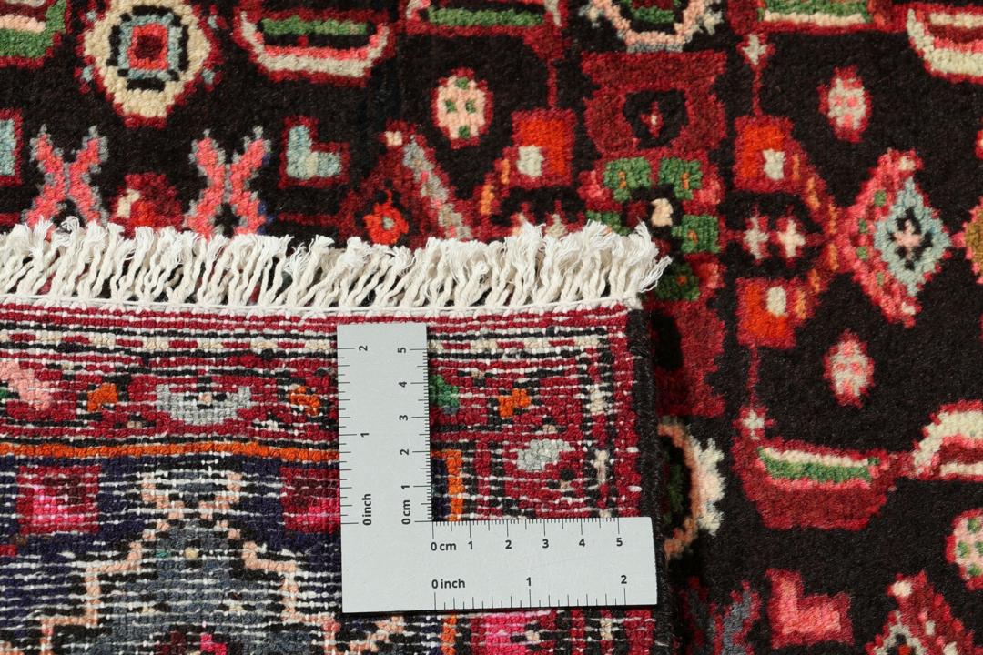 Hand-knotted Hamadan rug from the Middle East in dark-red and dark-blue tones.