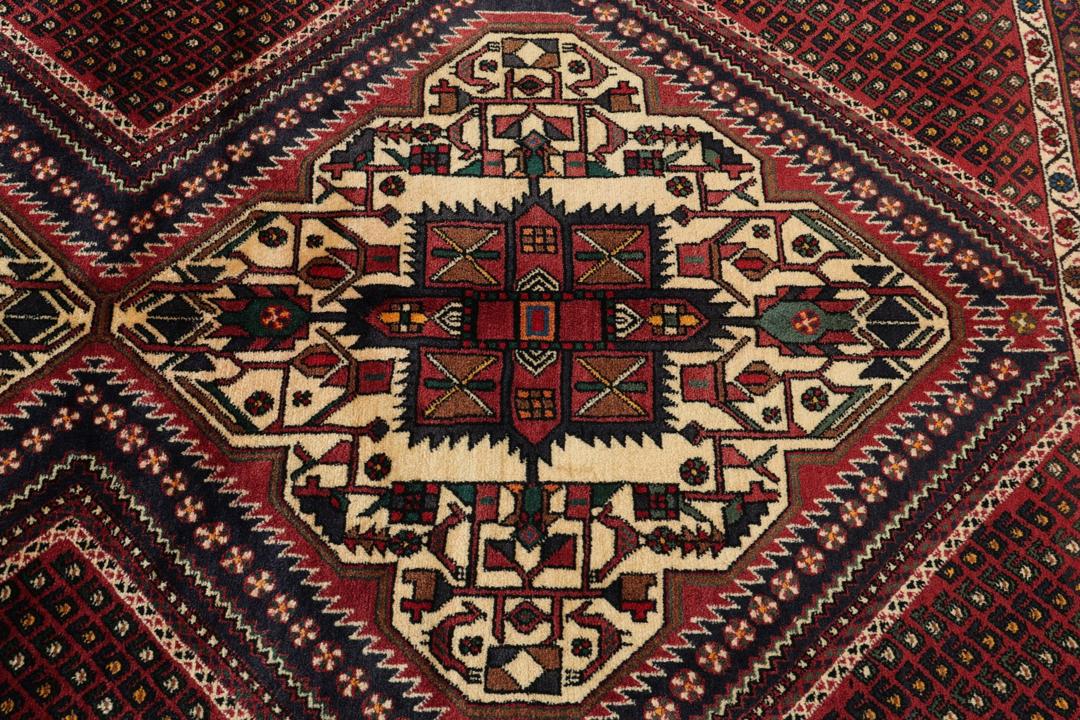 Hand-knotted Afshar Shahre Babak rug from the Middle East in dark-red