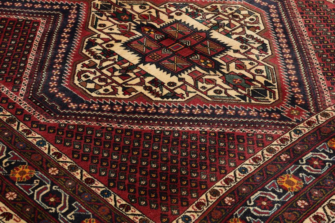 Hand-knotted Afshar Shahre Babak rug from the Middle East in dark-red