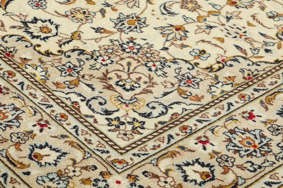 Hand-knotted Keshan rug from the Middle East with a beige base and floral patterns.