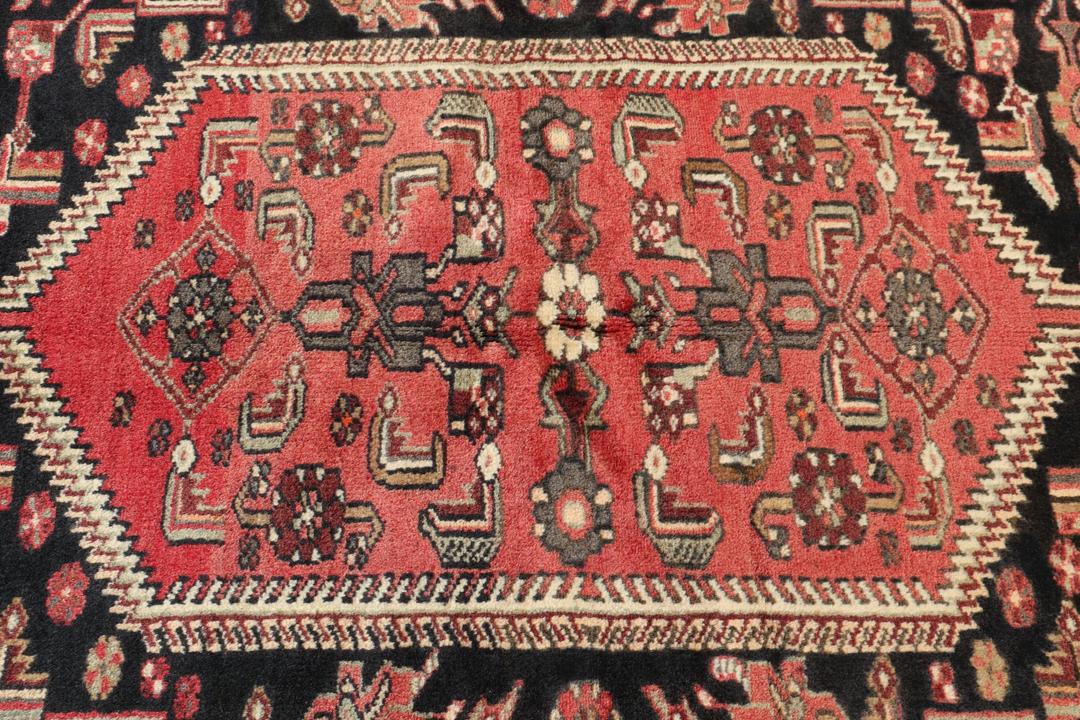 Hand-knotted Hamadan rug from the Middle East in deep dark-red and black tones.