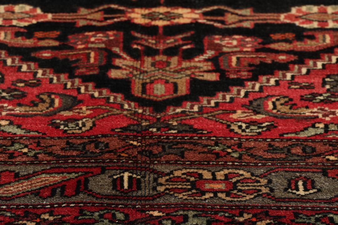 Hand-knotted Hamadan rug from the Middle East in deep dark-red and black tones.