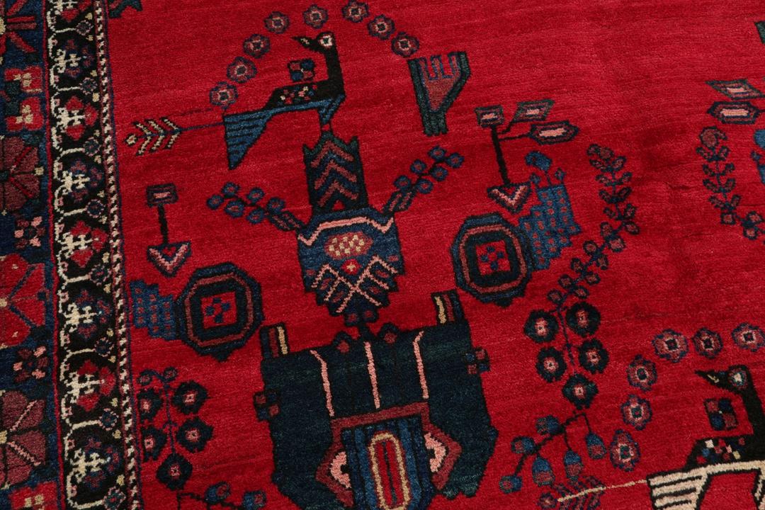 Handgeknoopt Afshar-tapijt uit het Midden-Oosten met een levendig rood veld en tribale motieven