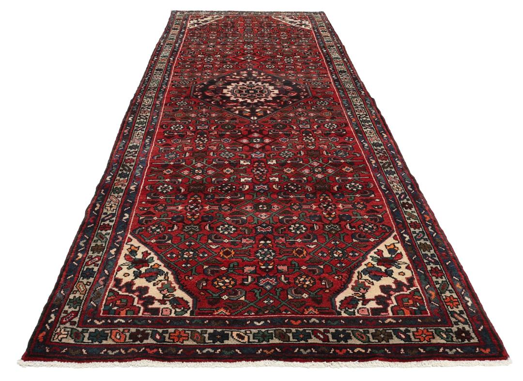 Hand-knotted Hosseinabad runner in red from the Middle East