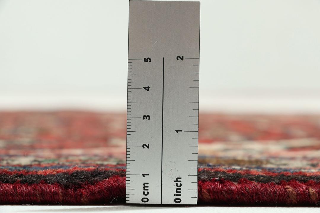 Hand-knotted Hosseinabad runner in red from the Middle East