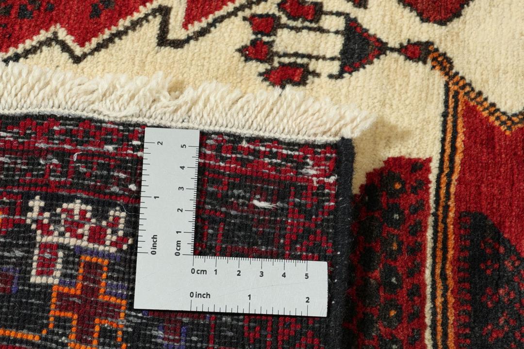 Håndknyttet Baluch-tæppe fra Mellemøsten med et rødt og beige mønster