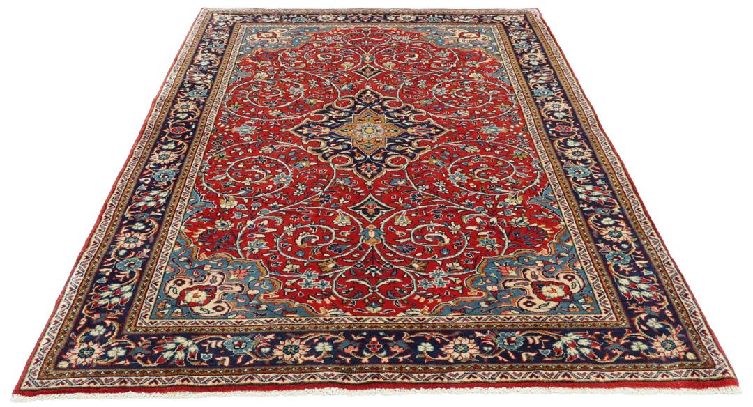 Hand-knotted Sarough rug with floral pattern in red and blue