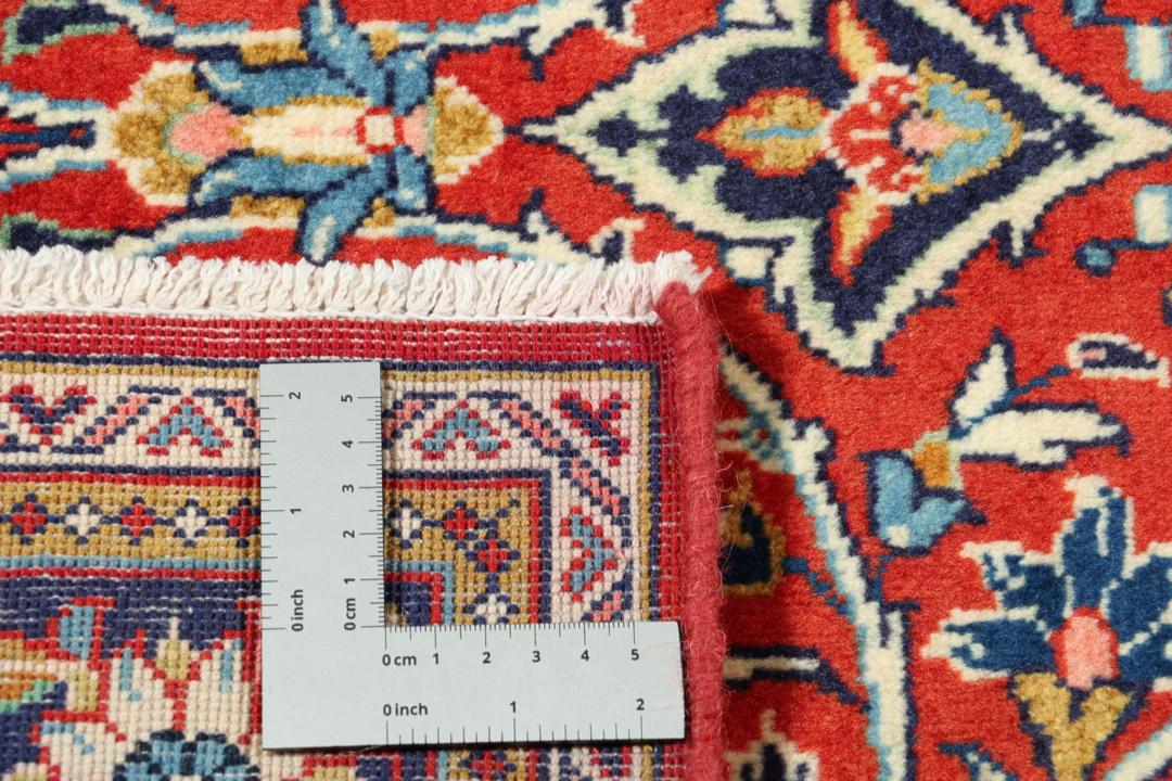 Hand-knotted Sarough rug with floral pattern in red and blue