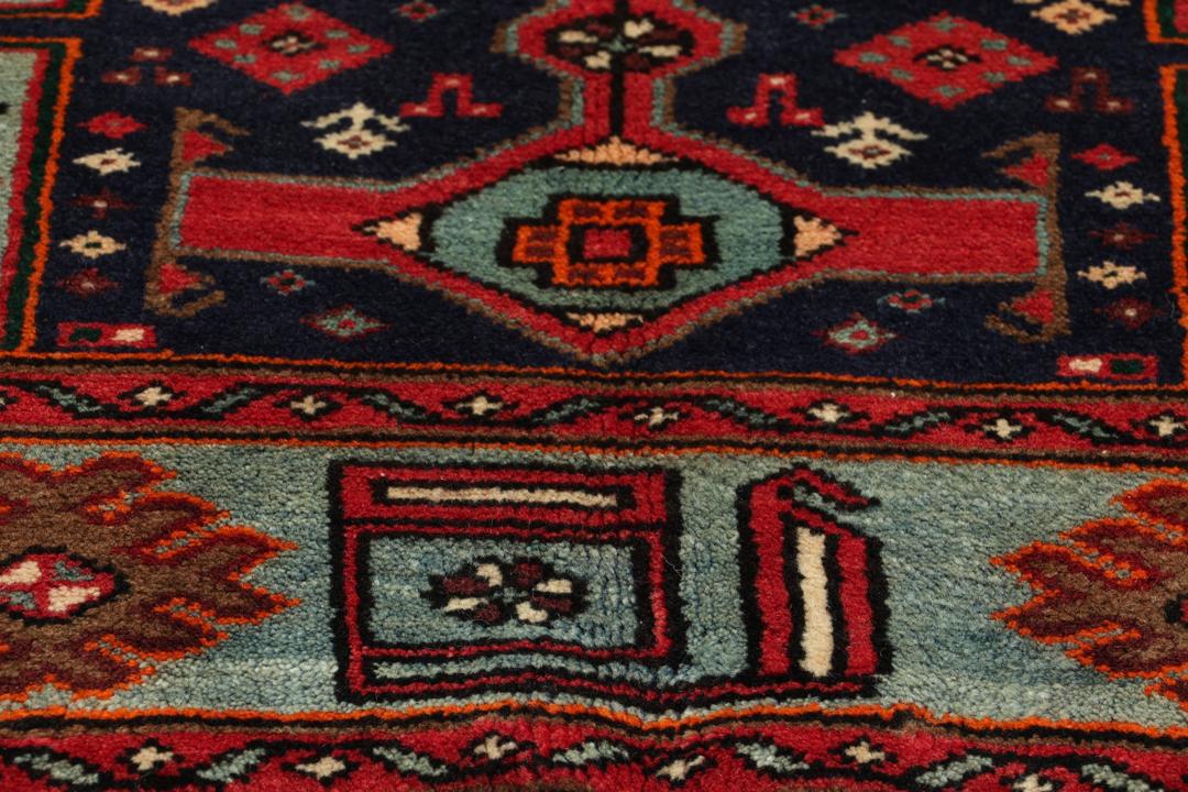 Hand-knotted Hamadan rug with traditional geometric patterns in red and blue tones from the Middle East