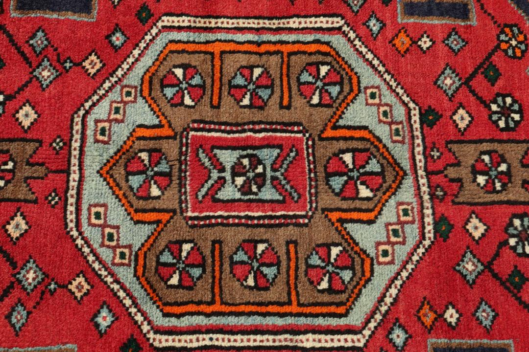 Hand-knotted Hamadan rug with traditional geometric patterns in red and blue tones from the Middle East