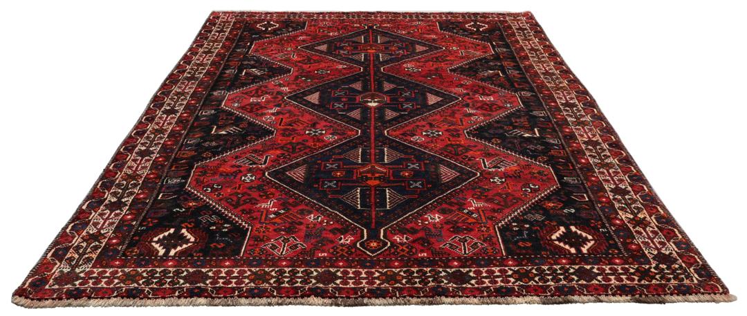 Handgeknoopt Shiraz-tapijt uit het Midden-Oosten met een levendig rood en blauw geometrisch ontwerp.