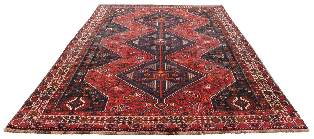 Handgeknoopt Shiraz-tapijt uit het Midden-Oosten met een levendig rood en blauw geometrisch ontwerp.