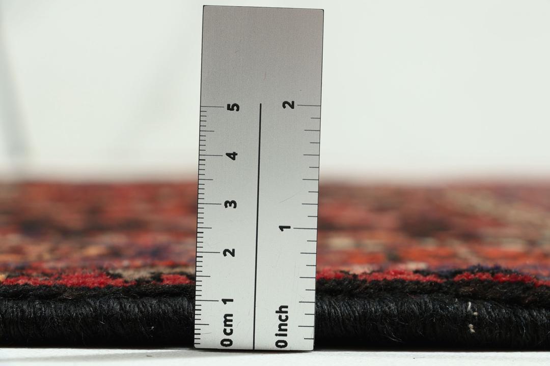 Hand-knotted Hamadan rug from the Middle East in dark red and black tones