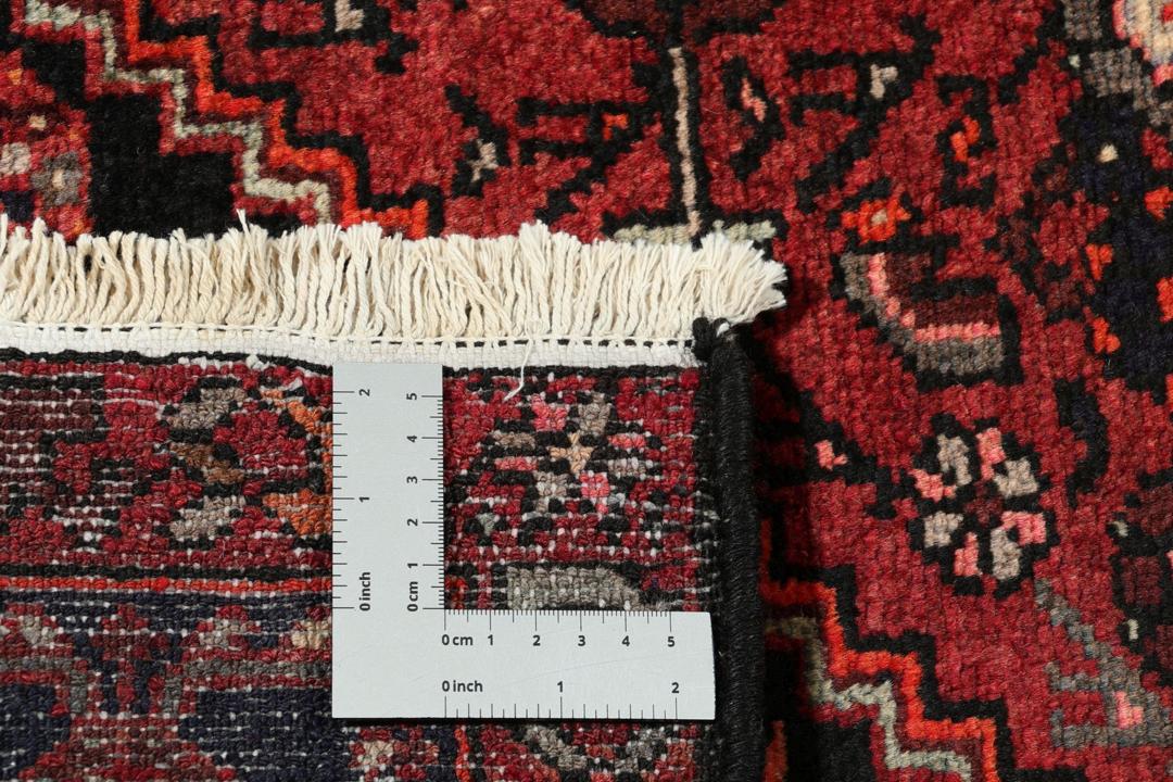Hand-knotted Hamadan rug from the Middle East in dark red and black tones