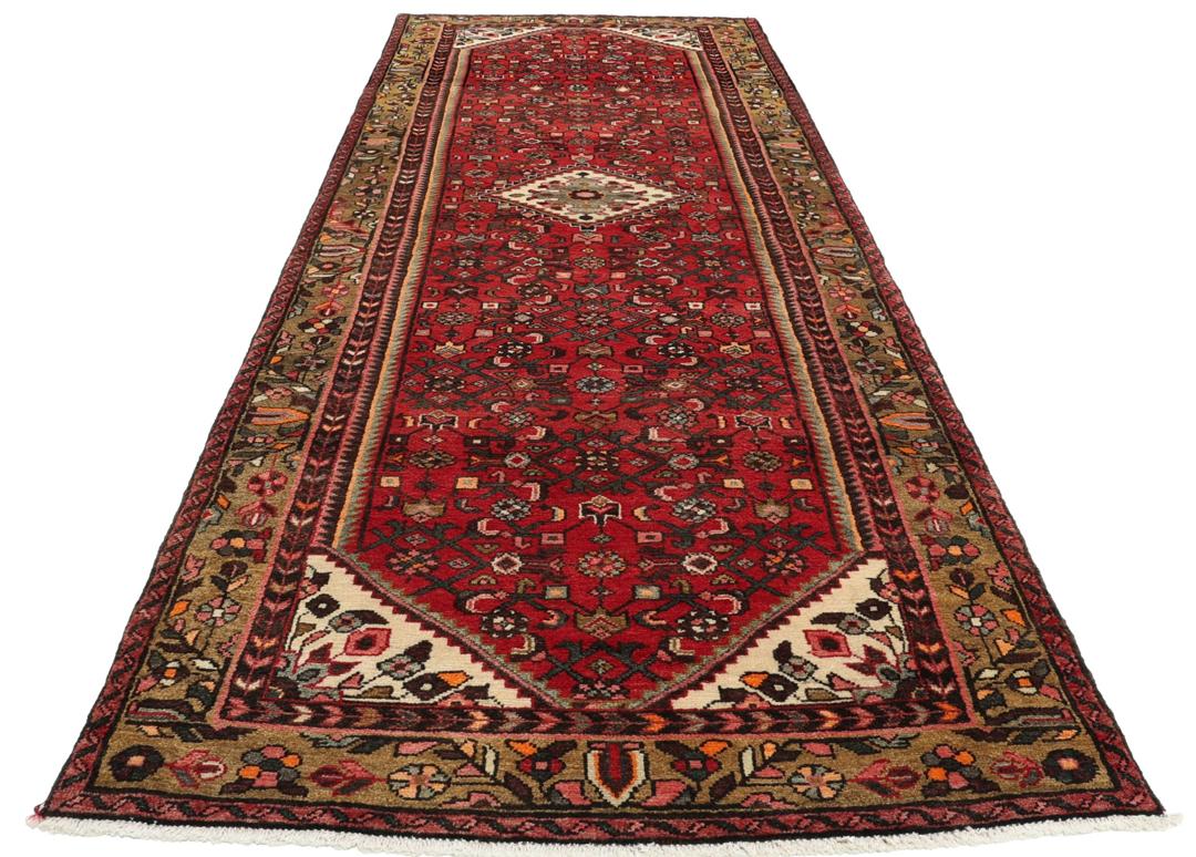 Hand-knotted Middle Eastern runner rug in vibrant red with intricate geometric patterns