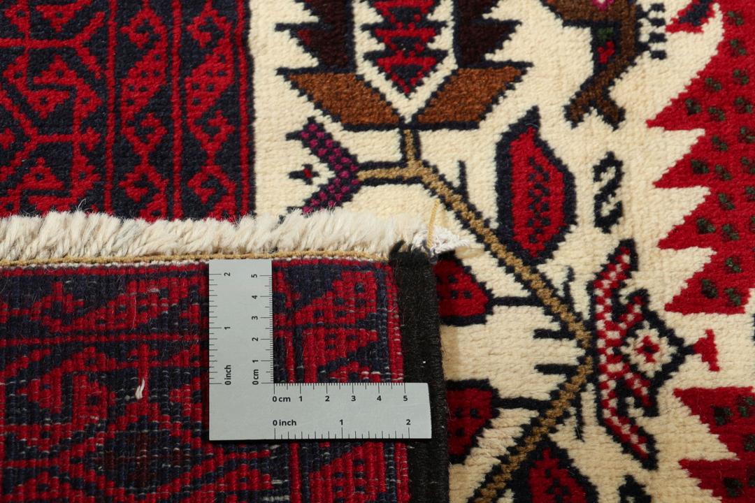 Hand-knotted Middle Eastern Baluch rug in red and cream tones