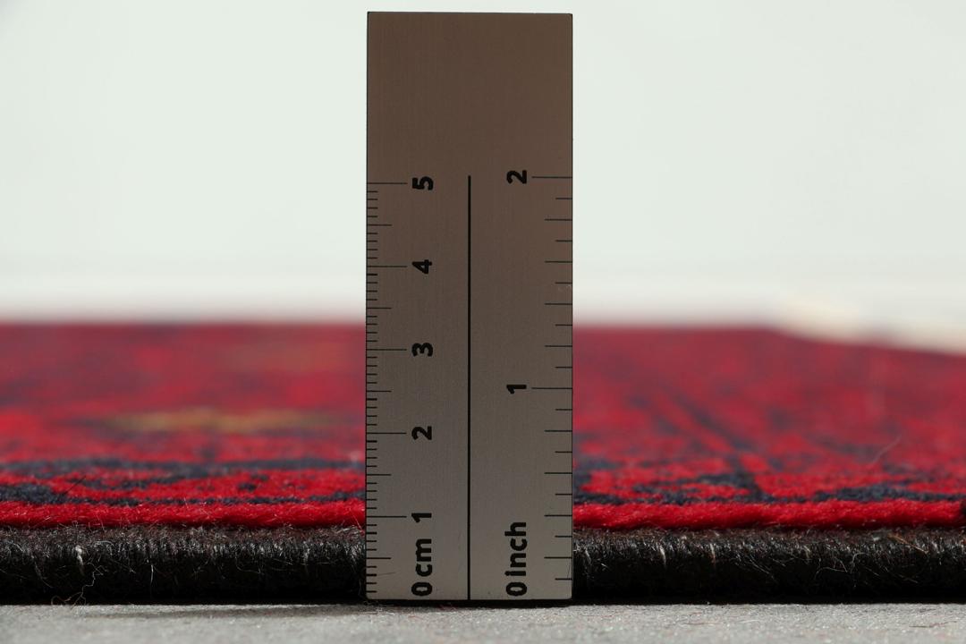 Hand-knotted Middle Eastern Baluch rug in red and cream tones