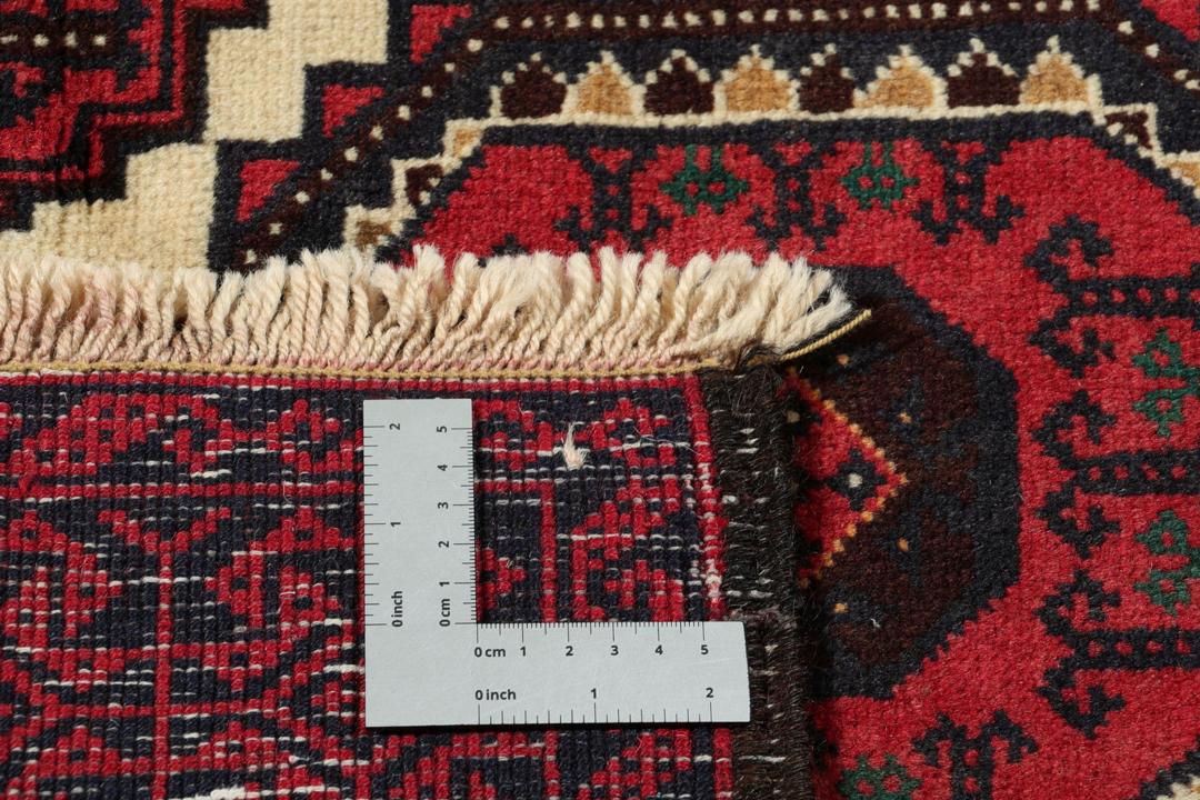 Handgeknoopt Beluch-tapijt uit het Midden-Oosten met rode en beige geometrische patronen