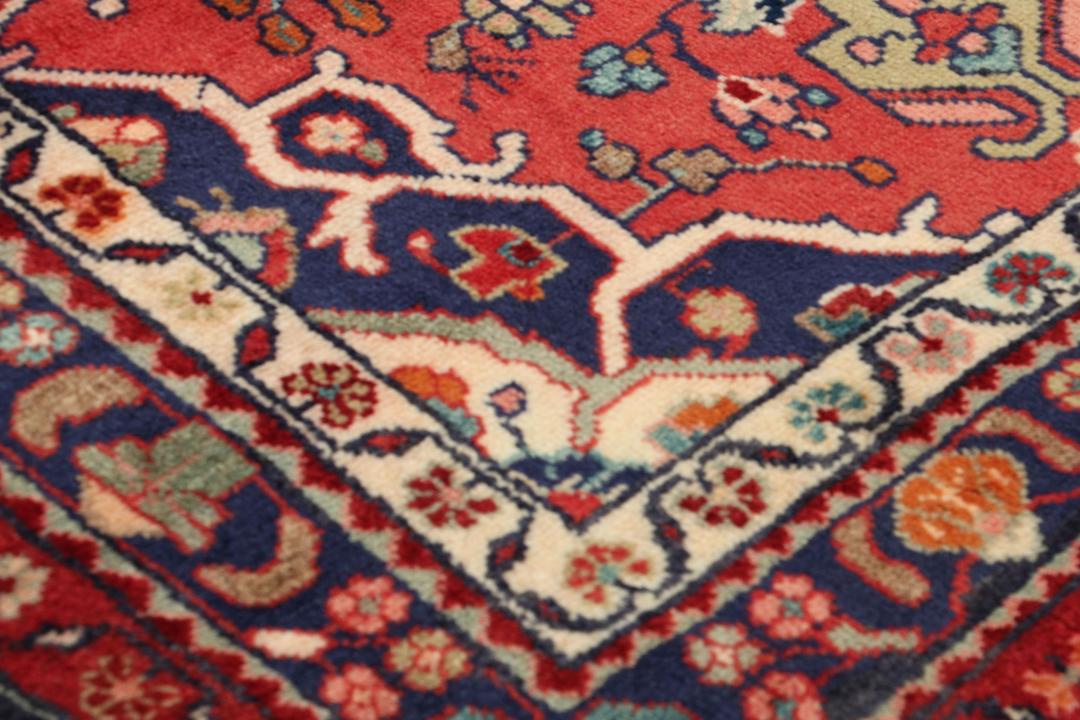 Hand-knotted Hamadan runner rug in red with traditional Middle Eastern geometric patterns.