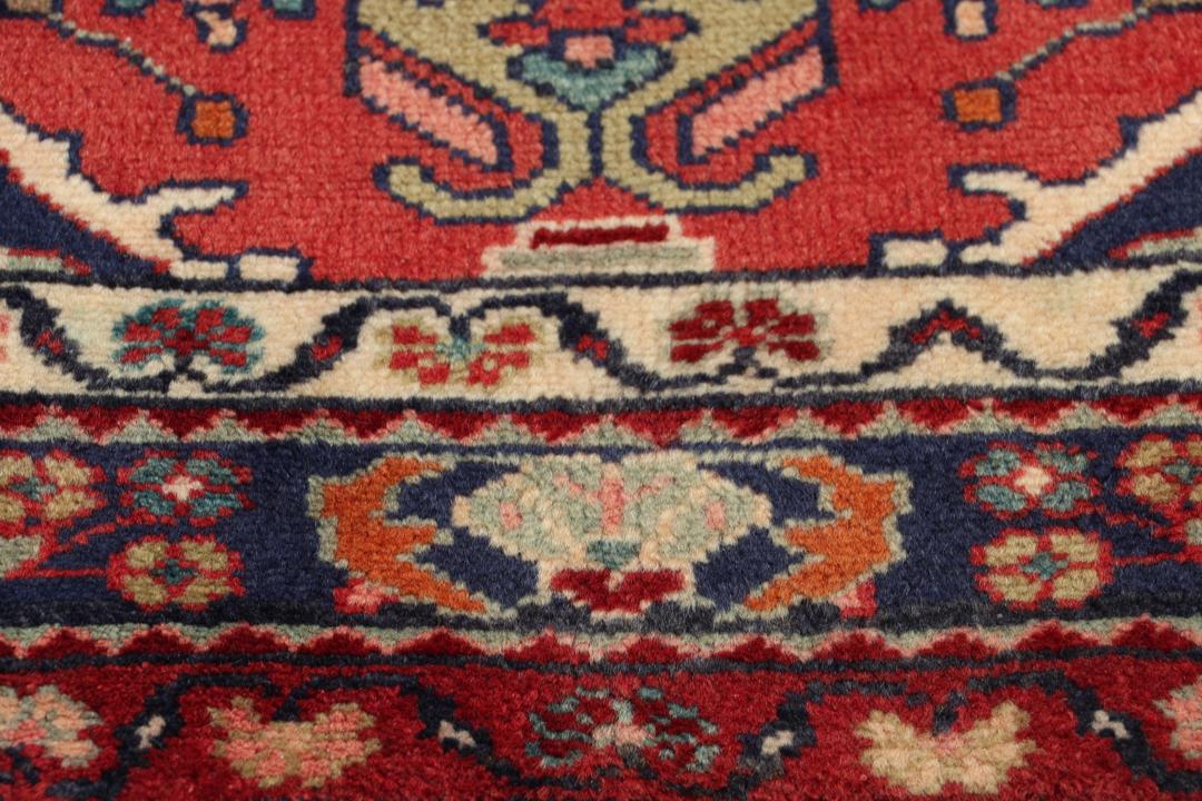 Hand-knotted Hamadan runner rug in red with traditional Middle Eastern geometric patterns.