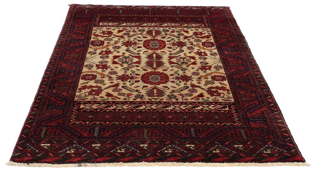 A hand-knotted Baluch rug from the Middle East featuring red and beige floral patterns.
